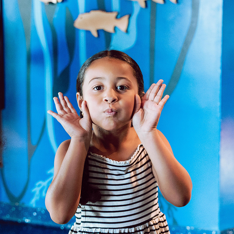 Girl making a fish face