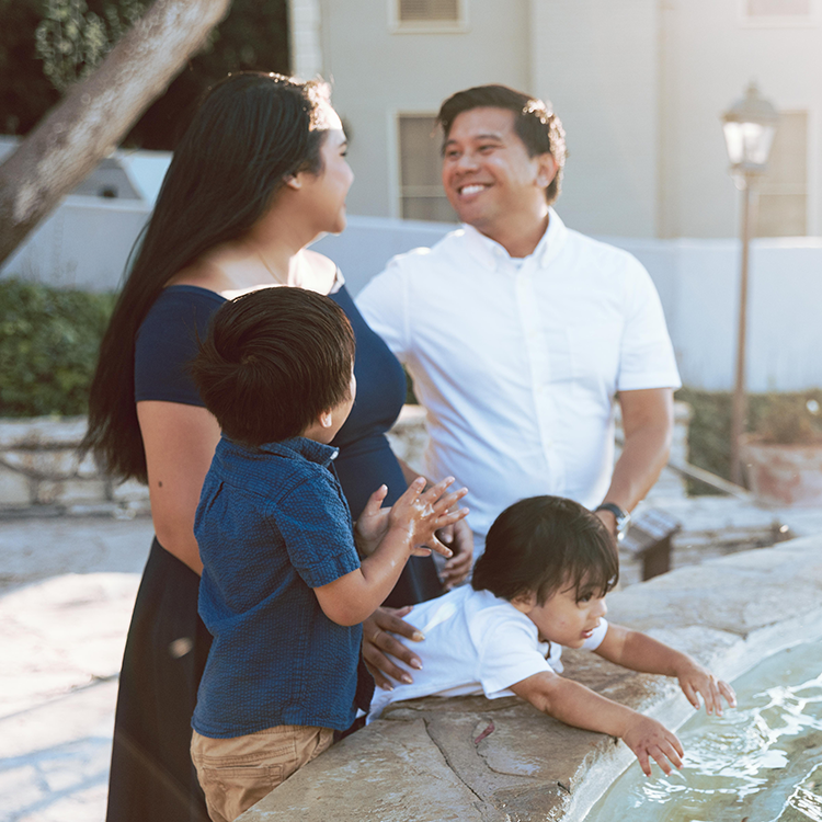 Family at a water fountain