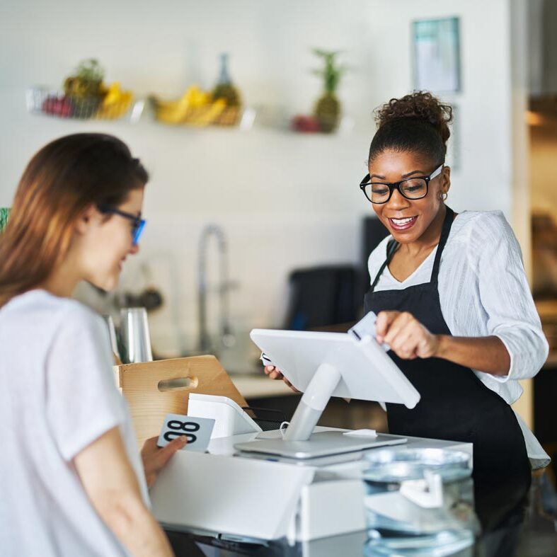 Woman paying in the store