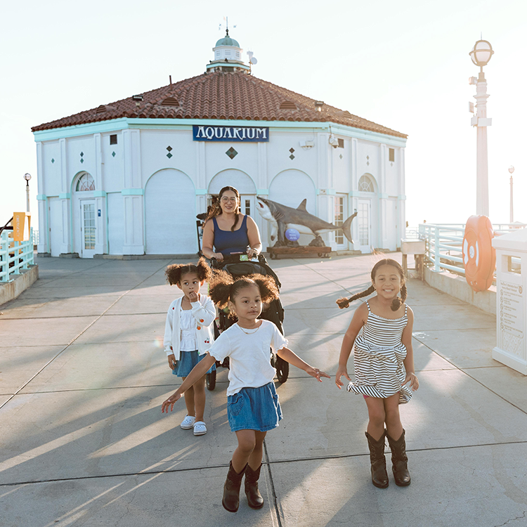 Family walking on the pier