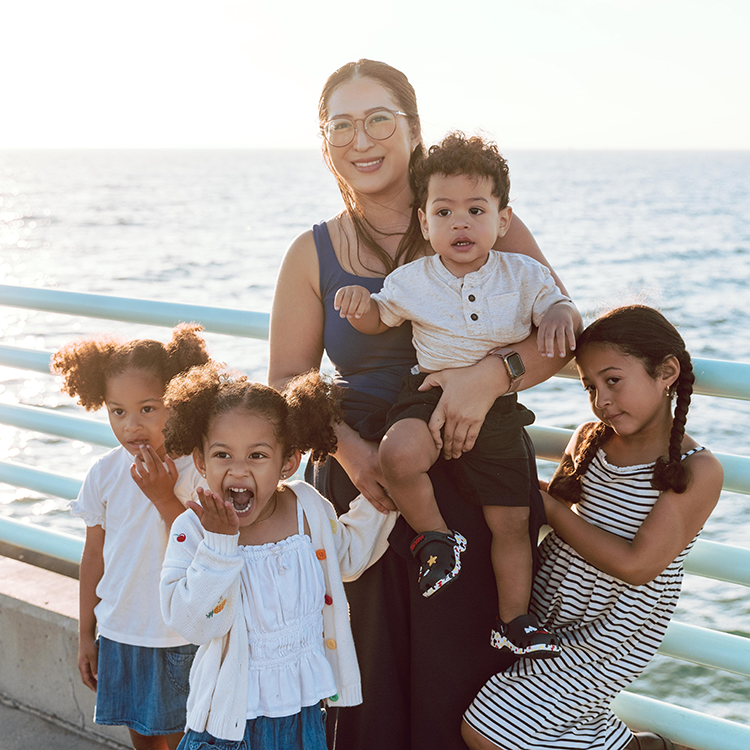 Family standing on the pier