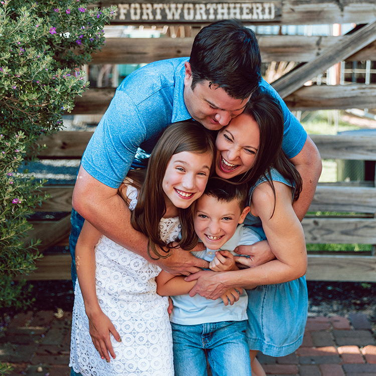 Family hugging and laughing
