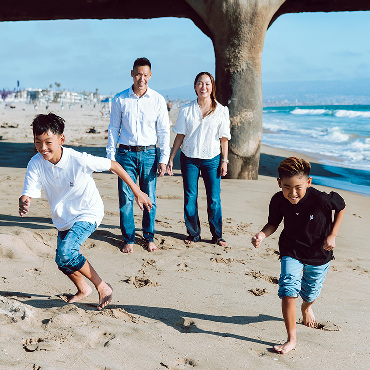Family playing on the beach